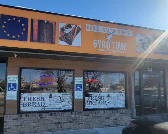 Storefront of Dar El Salam Market, home of Gyro Time in Sioux Falls, under a blue sky